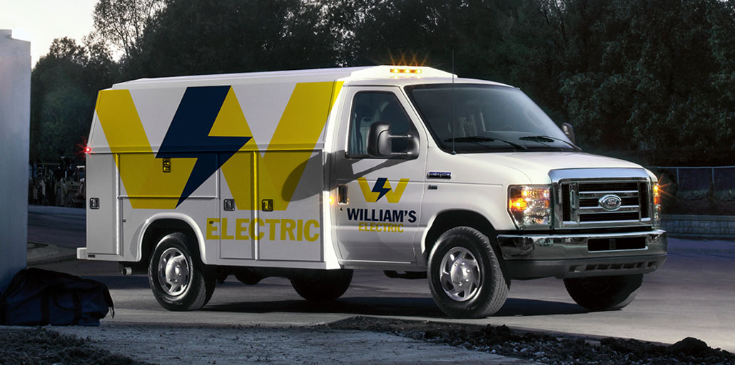 Ford Super Duty pickup with company logo and information printed on the doors.