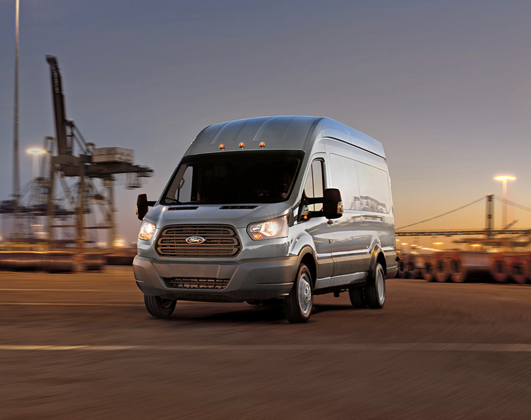 A Ford Transit Van in a parking lot.