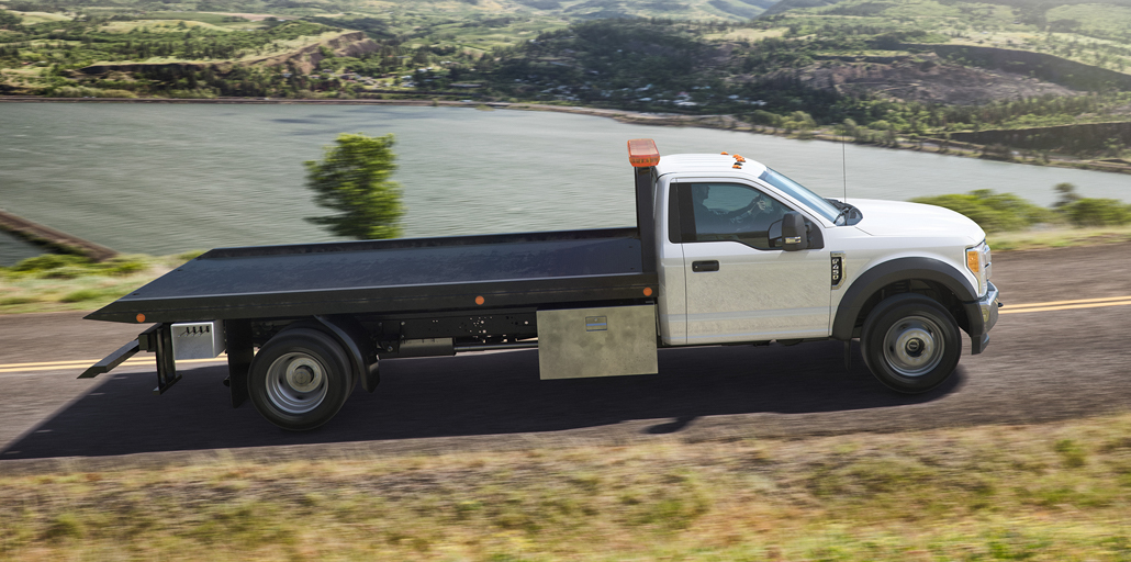 Ford Super Duty Chassis driving up the road.